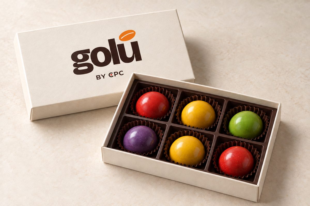 Estuche Golú abierto con seis bombones de colores
